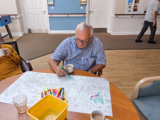Resident colouring a jungle scene